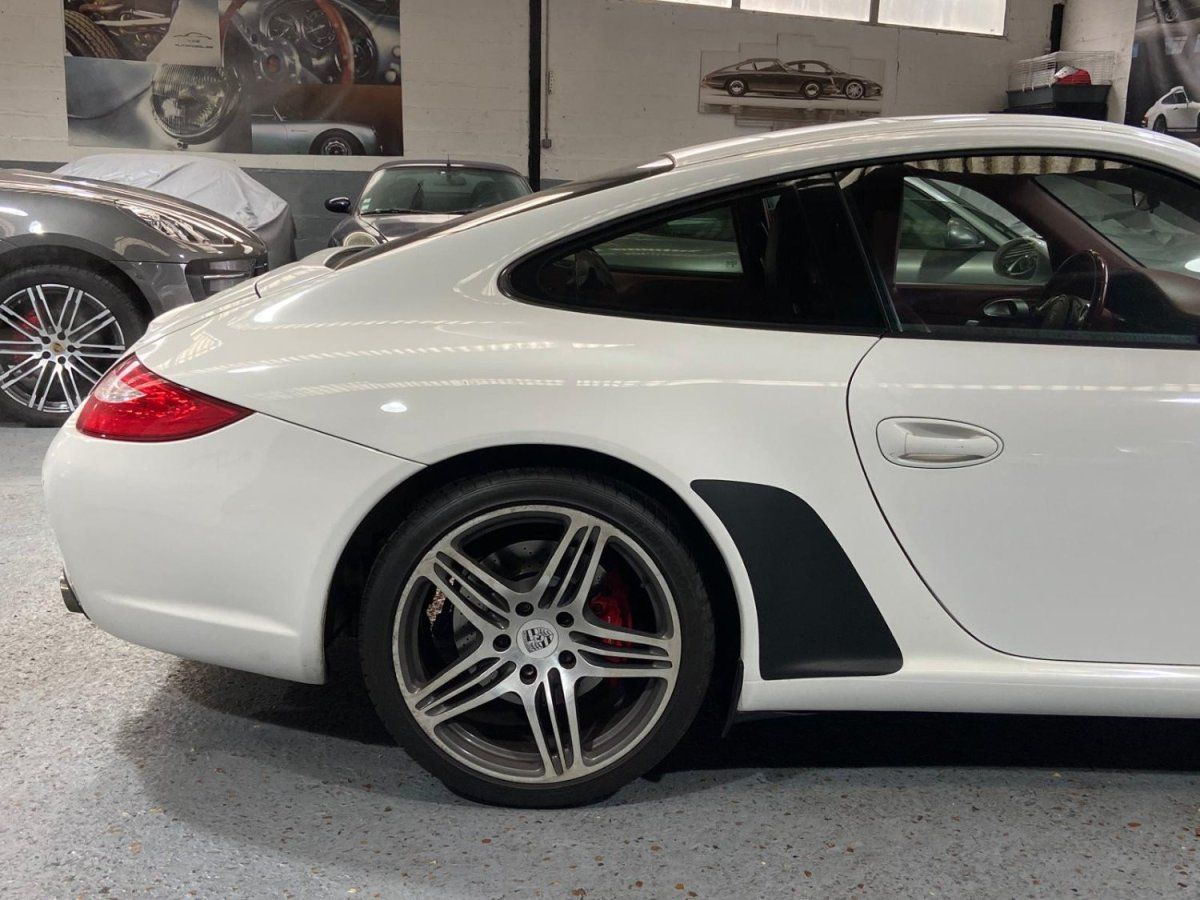 Porsche 997 Carrera 2009 — profil lateral (9)