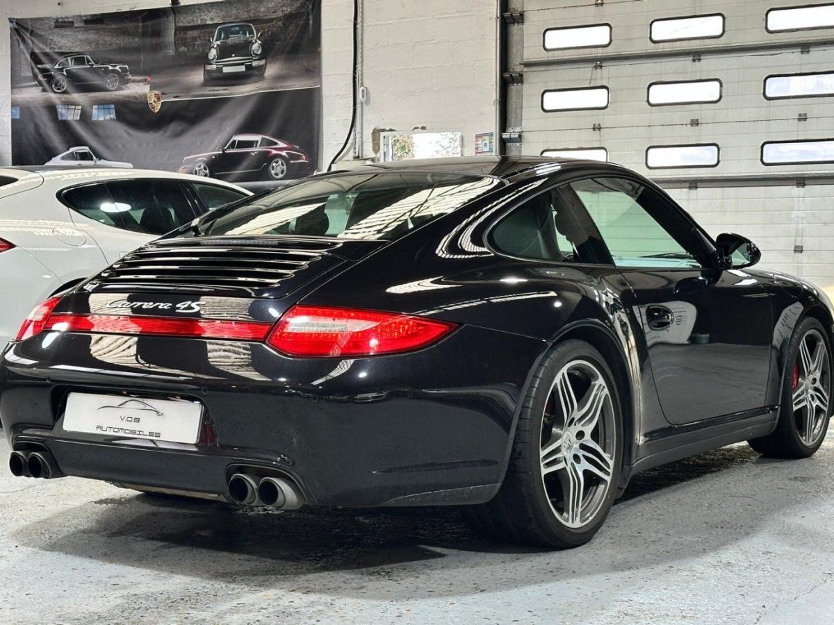 Porsche 997 Carrera 4S 2009 — vue arriere trois-quarts (11)